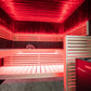 Sauna Fenix com luzes vermelhas e bancos de madeira clara.